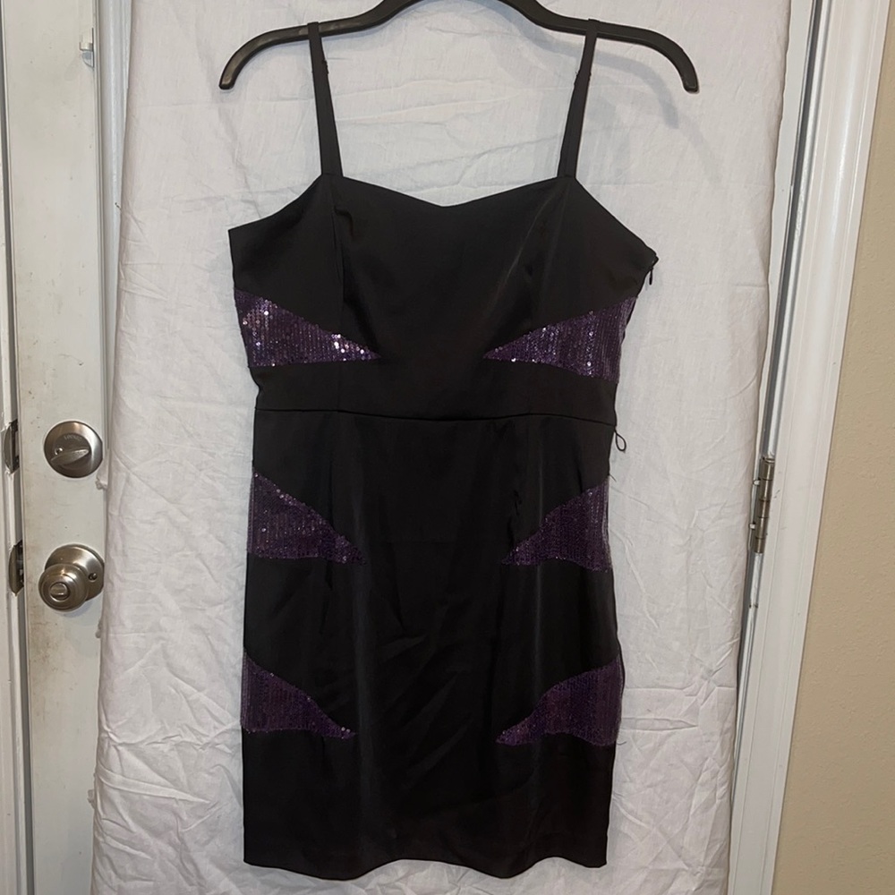 Black sheath dress with side zipper.